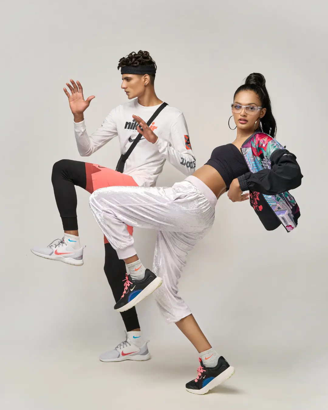 Dynamic studio editorial by a fashion stylist in Bangalore featuring male and female models in coordinated Nike streetwear and athletic apparel.